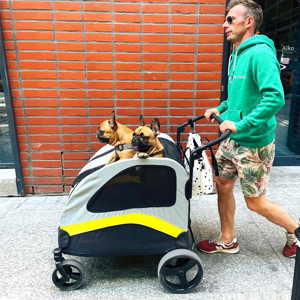 Pei's Corner pet stroller with two French Bulldogs, featuring a durable design with yellow and black mesh windows, perfect for pet mobility and outdoor walks on urban streets